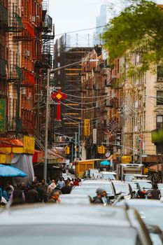 A crowded city street scene in Chinatown capturing vibrant urban life and architecture.