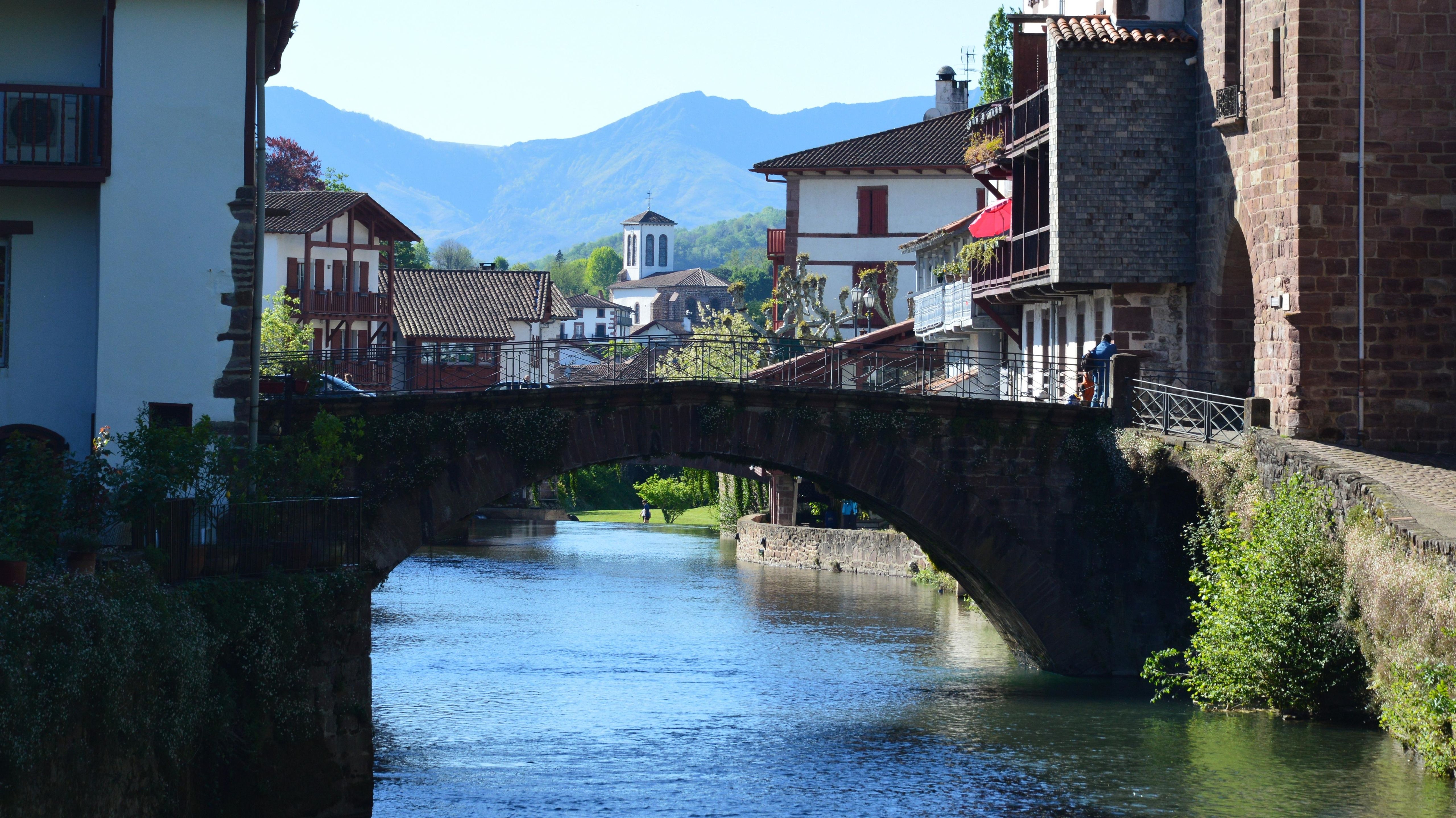 Picturesque view of a bridge in Saint-Jean-Pied-de-Port, France, emphasizing its rustic charm.
