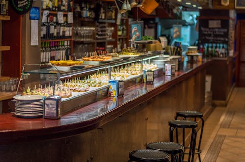 A bar with a long counter and stools