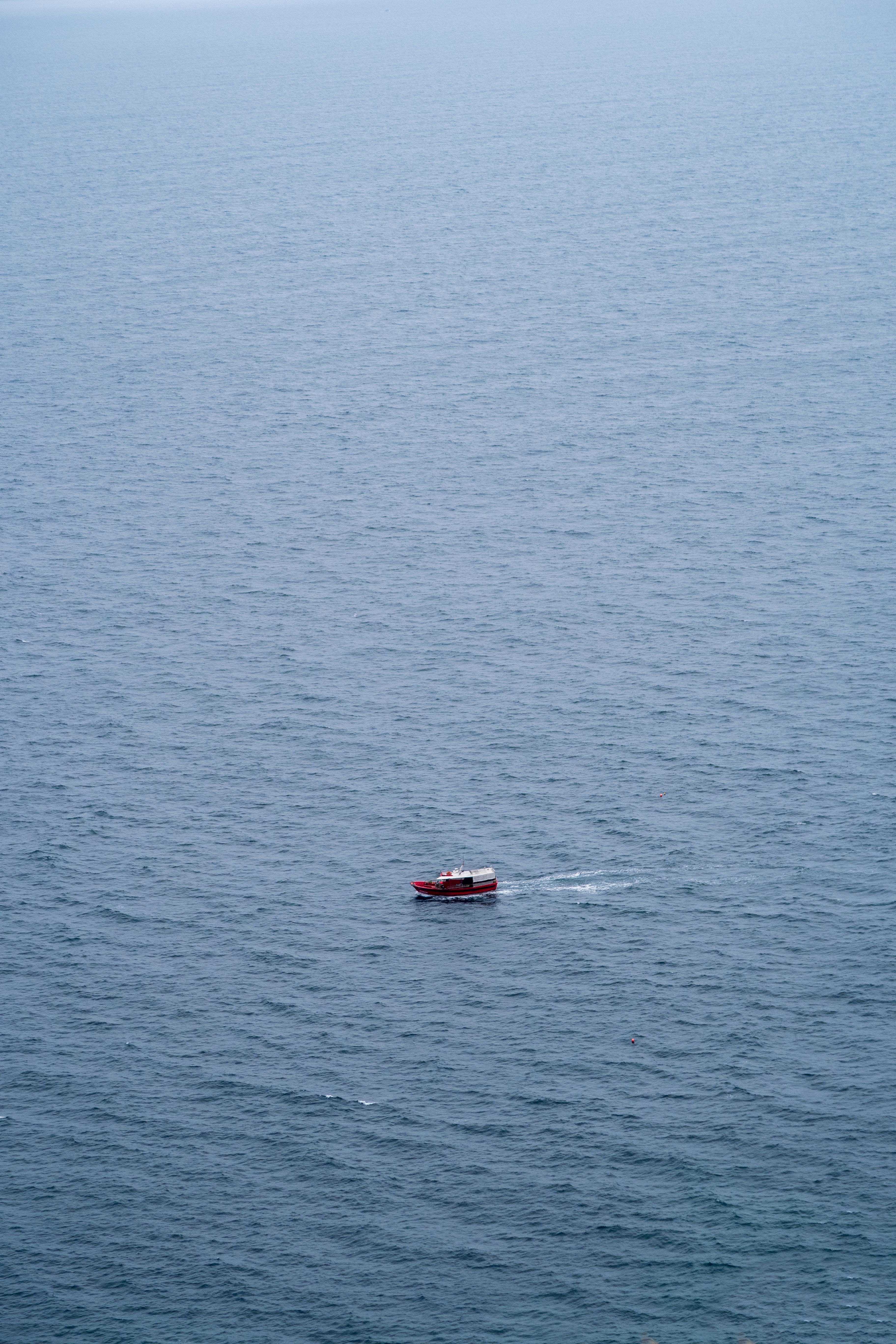 Aerial View of a Lone Motorboat at the Sea · Free Stock Photo