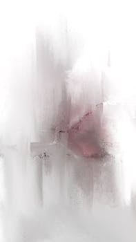 Abstract artistic design featuring soft white and pink brush strokes with a misty effect.