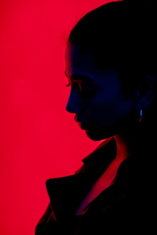 A woman in black and red silhouette