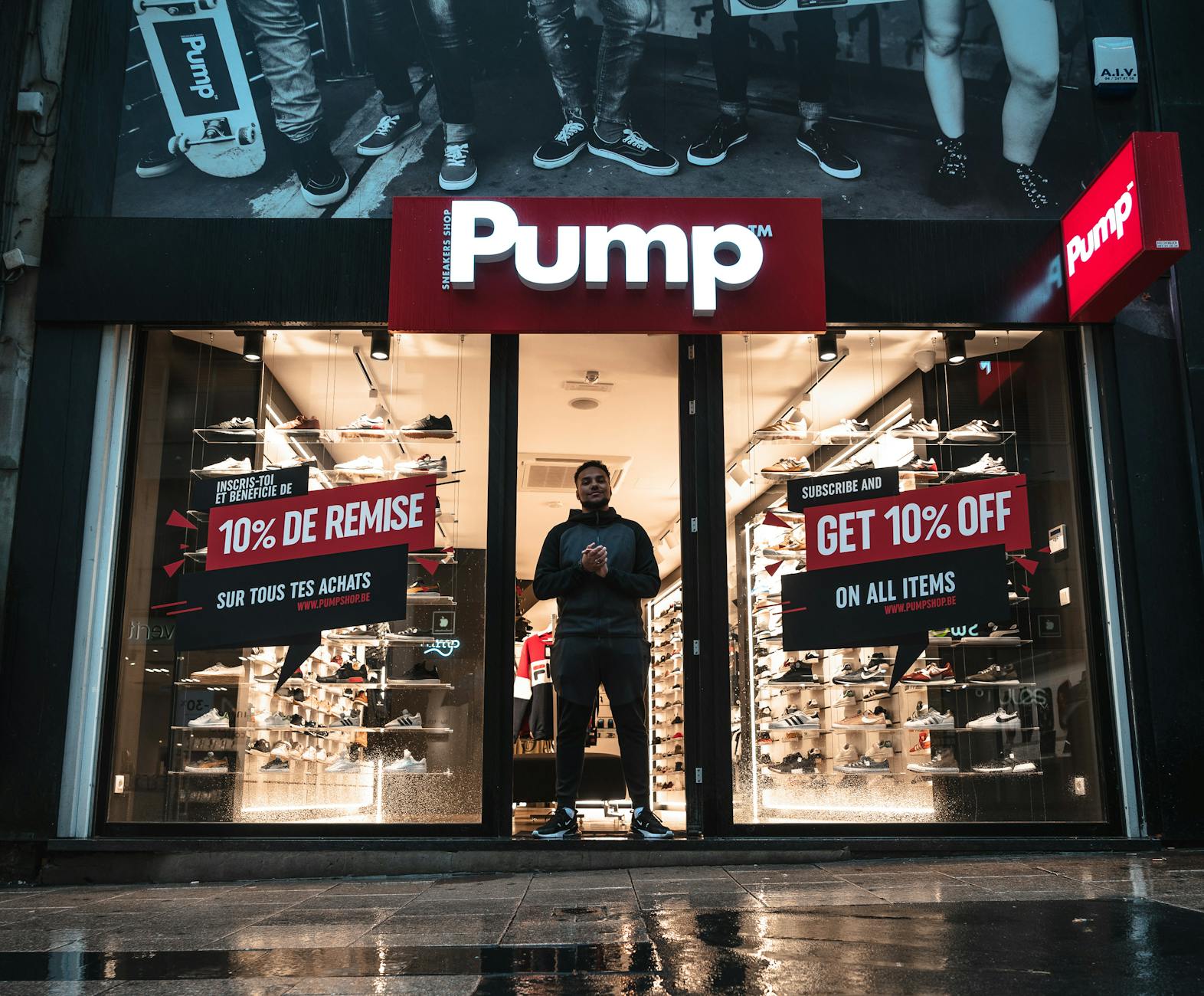 Sky'S The Limit: Uncover The Best Deals On Cheap Flights With These Booking Sites 1 illuminated shoe store pump in brussels with sale signs and reflections at night.