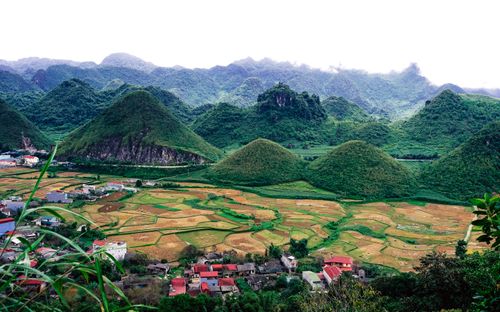 Free Beautiful view of Vietnam's rolling hills and fields under a cloudy sky. Stock Photo
