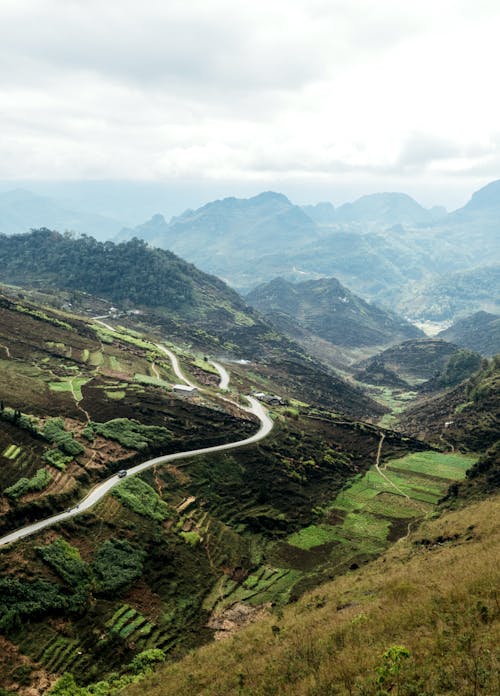 A winding road in the middle of a valley