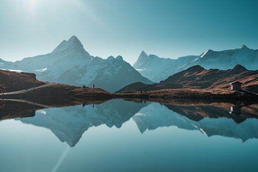Stunning view of the Swiss Alps with clear reflections in Bachalpsee Lake.