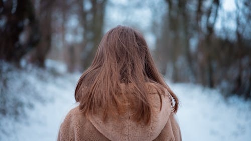 Photo of Woman Wearing Brown Hoodie