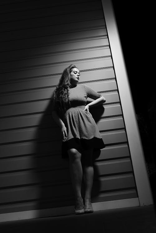 Grayscale Photo of Woman in Mini Dress