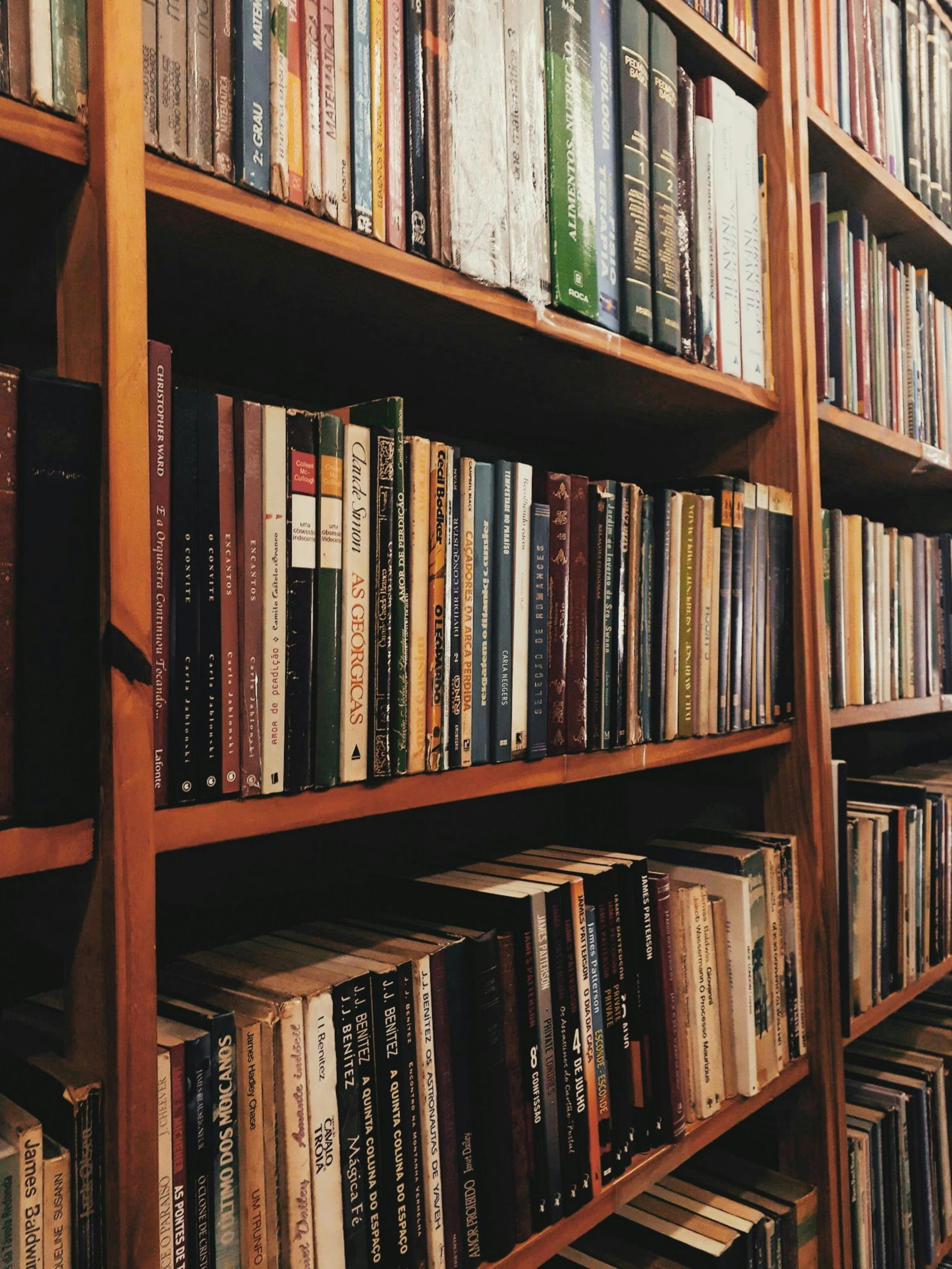Close Up Photo Of A Bookshelf Full Of Books Free Stock Photo