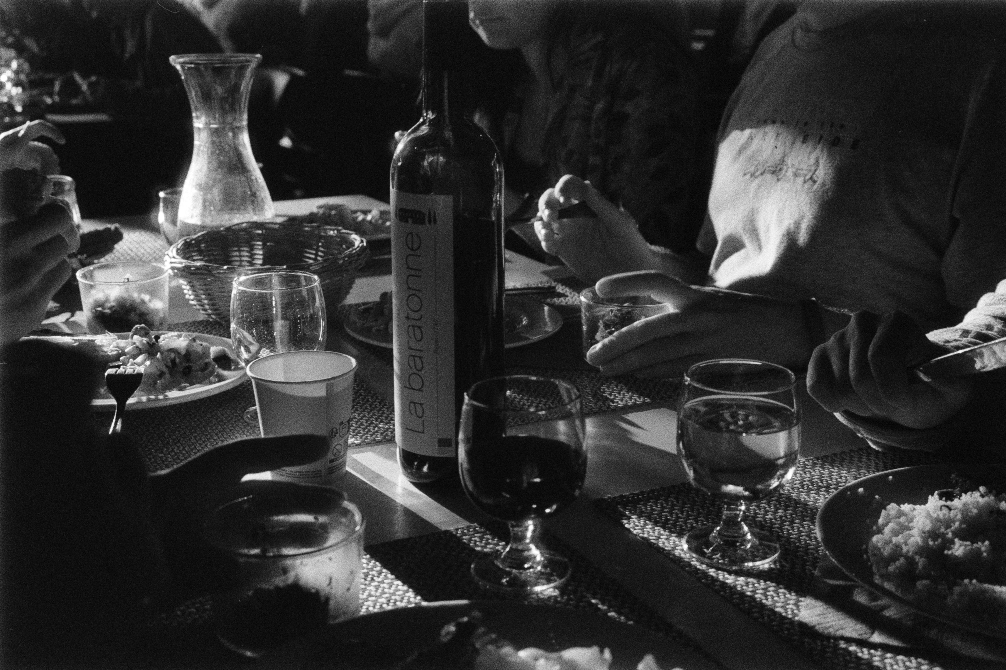 Black and White Photo of People Sitting at a Table and Dining · Free ...