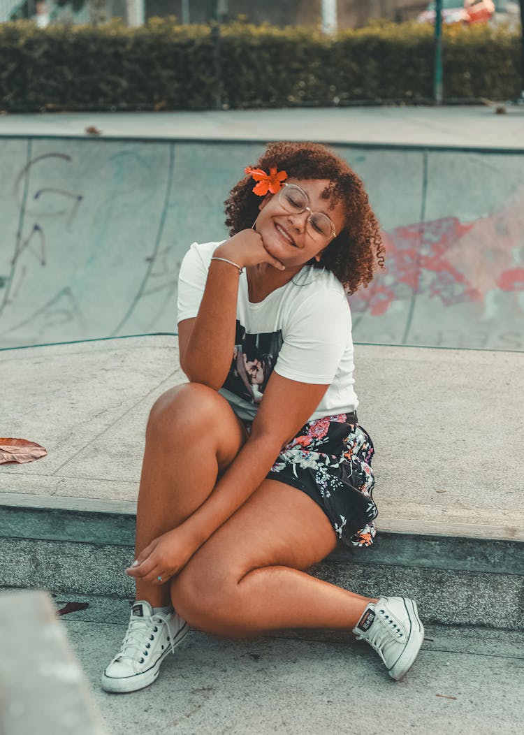 Woman Posing With Flower In Hair