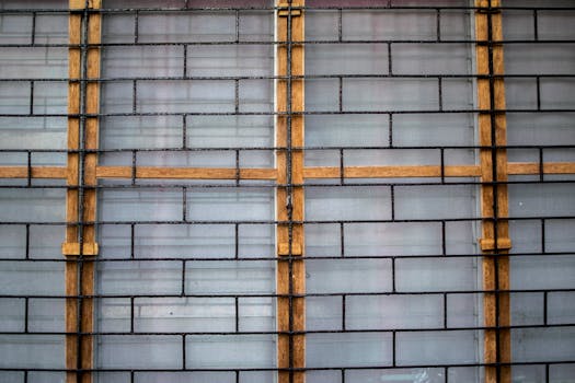 Close-up of a modern wall featuring brick and wood elements, showcasing unique architectural design.