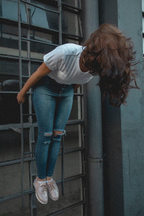 Photo of Woman Standing on Ladder