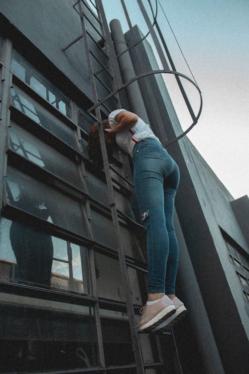 Photo of Woman Standing on Ladder