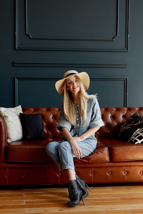 Free Photo of Woman Sitting on Sofa Stock Photo