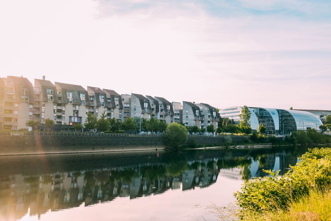 Development Near The Rivers Photo of Buildings Near River · Free Stock Photo