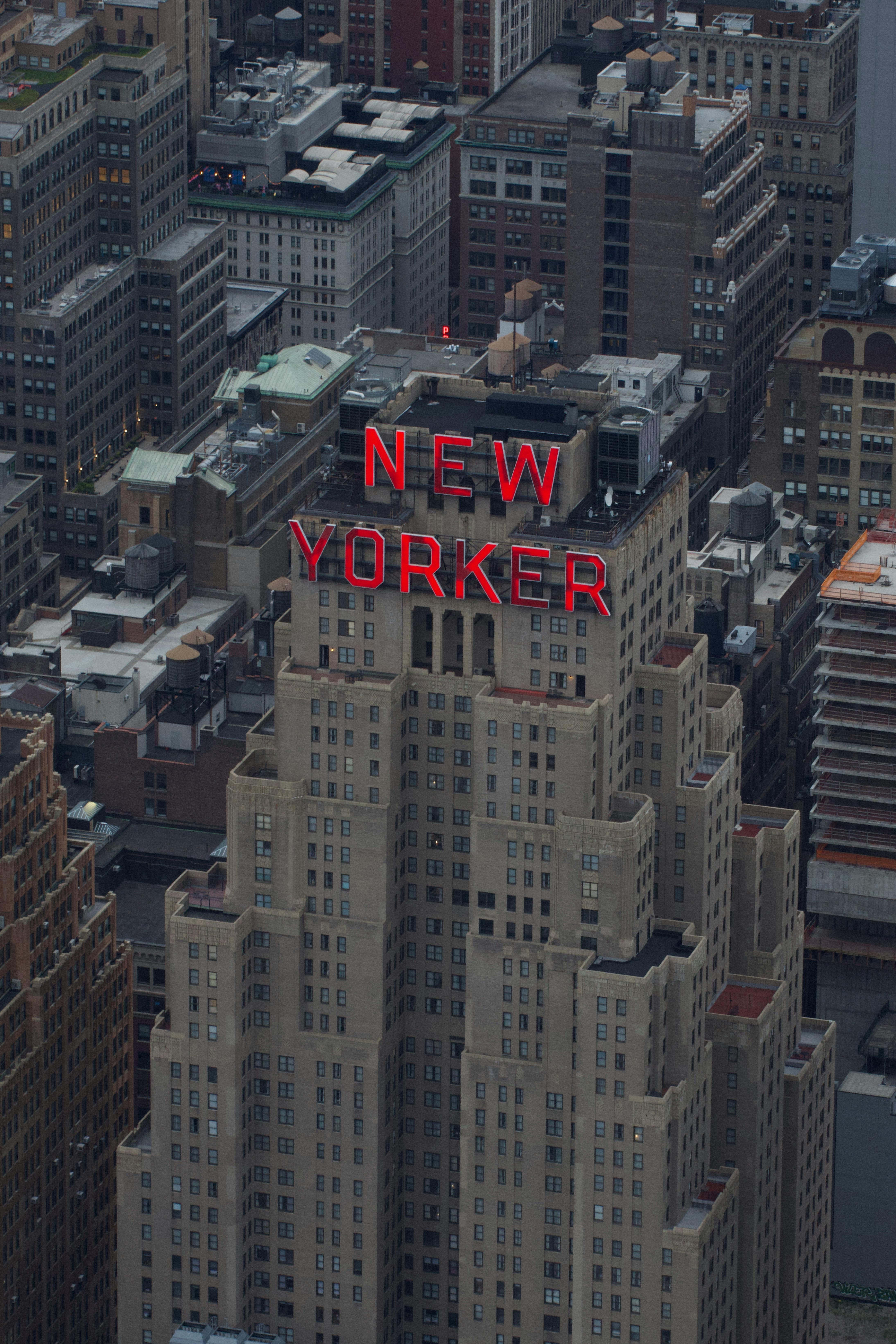 Aerial view of the iconic New Yorker Hotel amidst the New York City skyline. Perfect for travel and architecture themes.