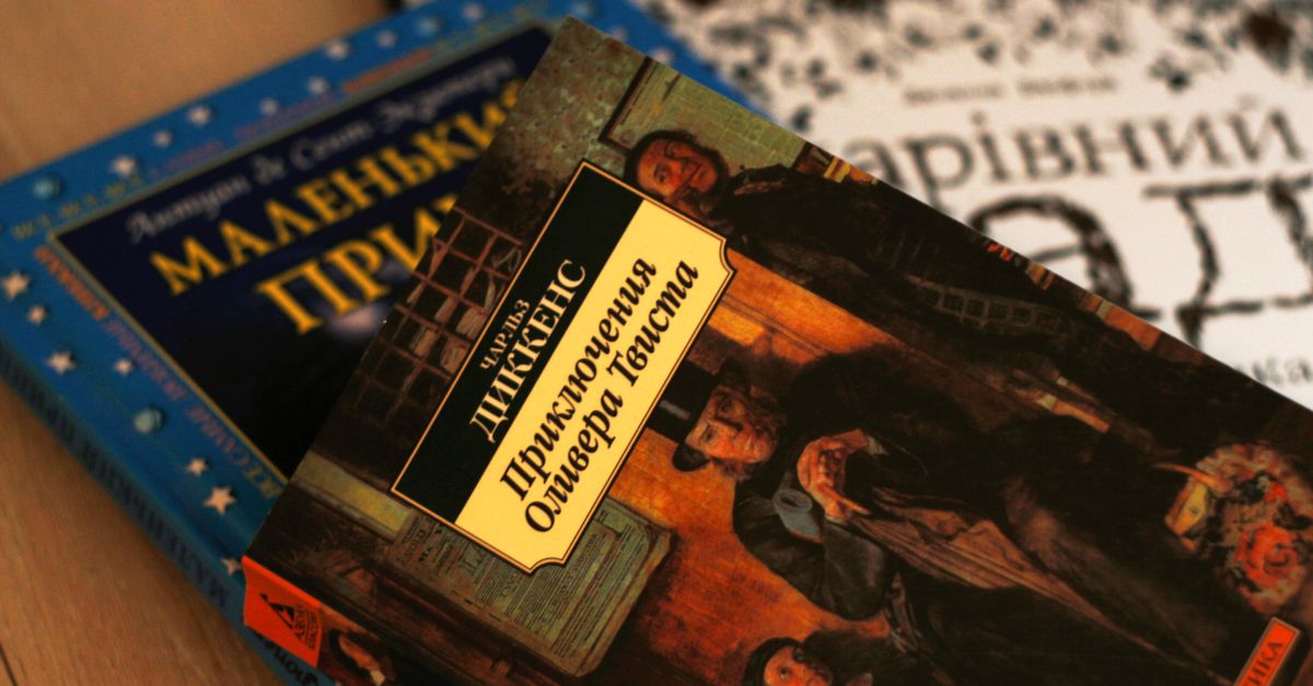 Close-up of Ukrainian versions of classic literature, including Oliver Twist by Charles Dickens.