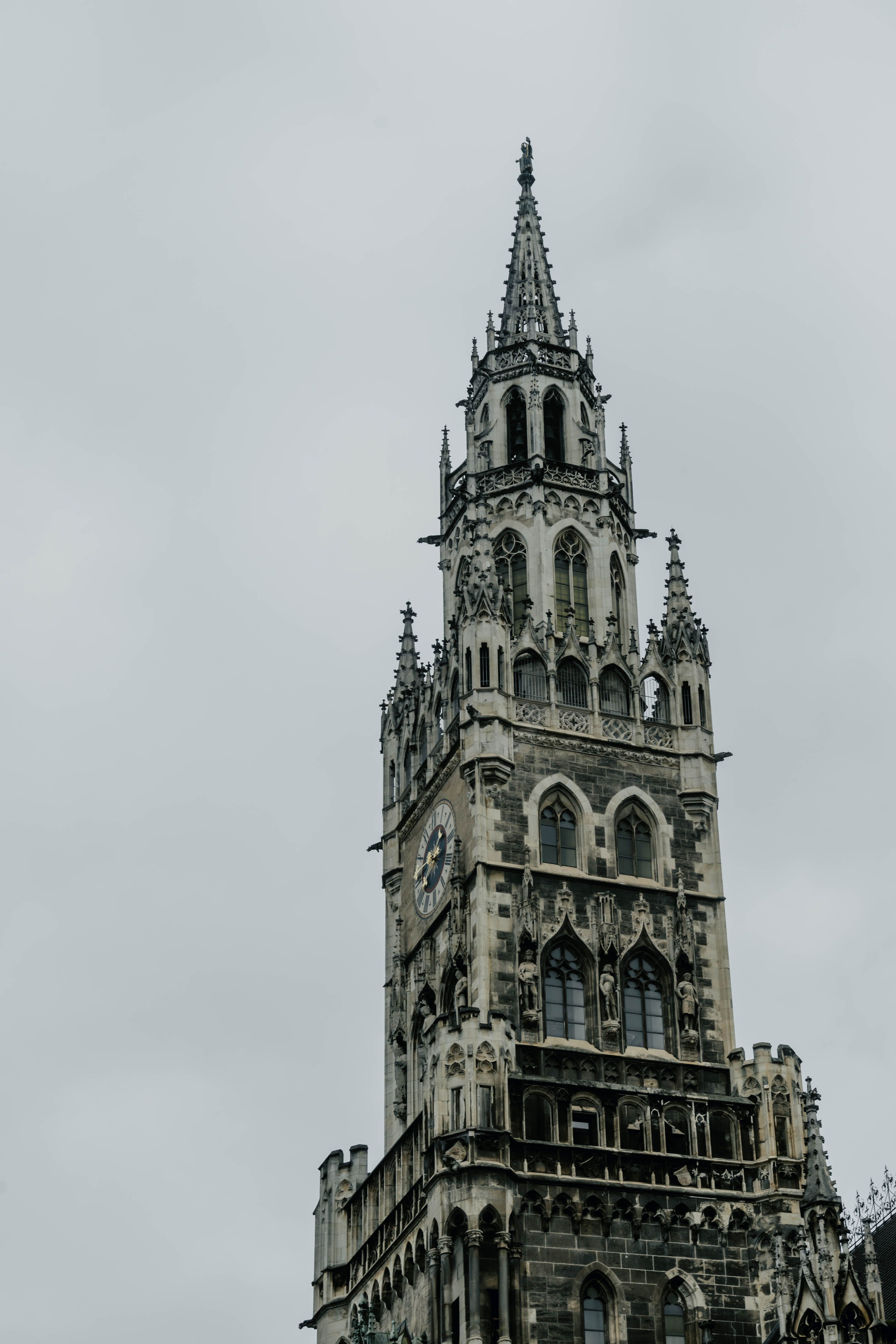 The New Town Hall tower at Marienplatz in Munich against an evening sky