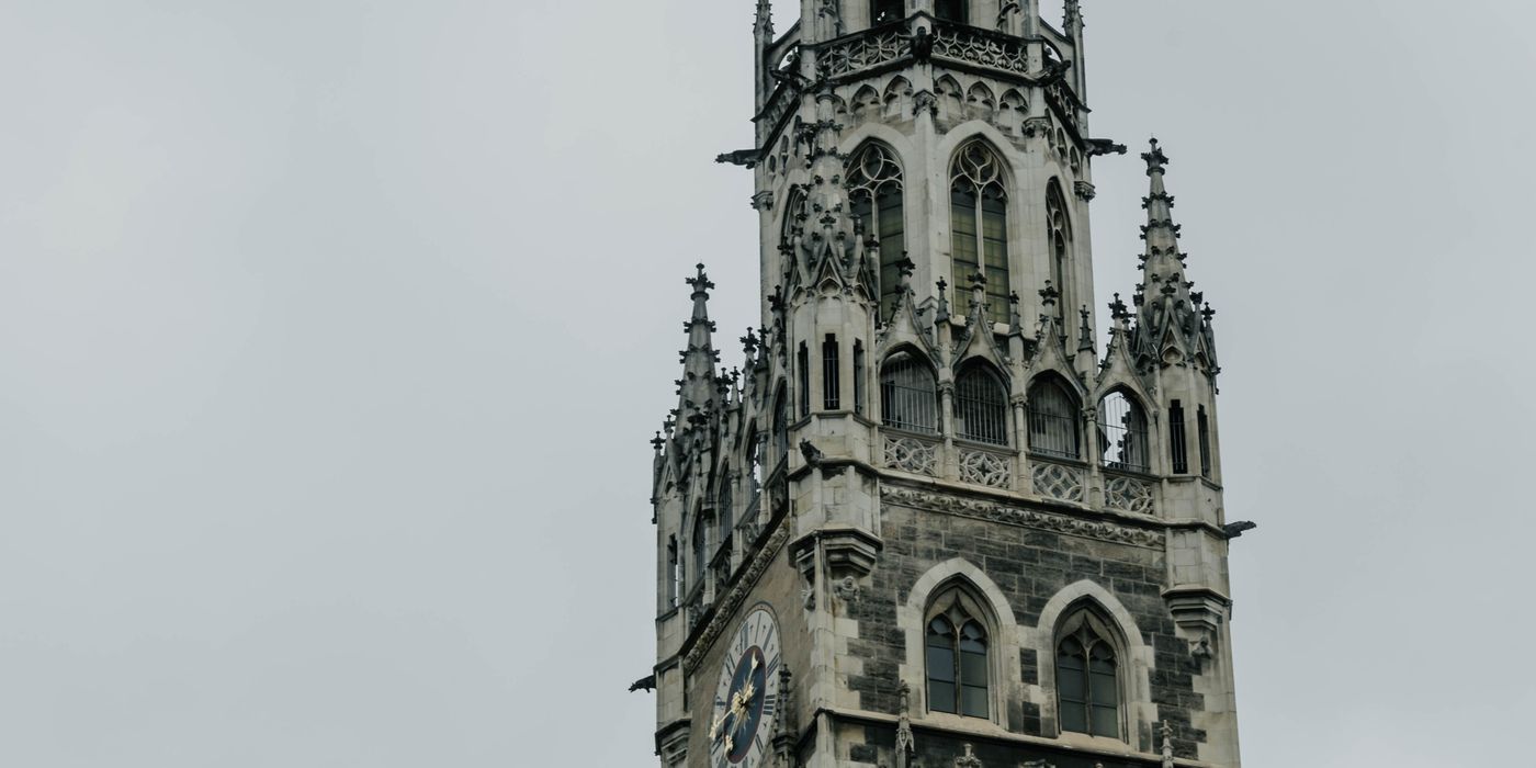 The New Town Hall tower at Marienplatz in Munich against an evening sky