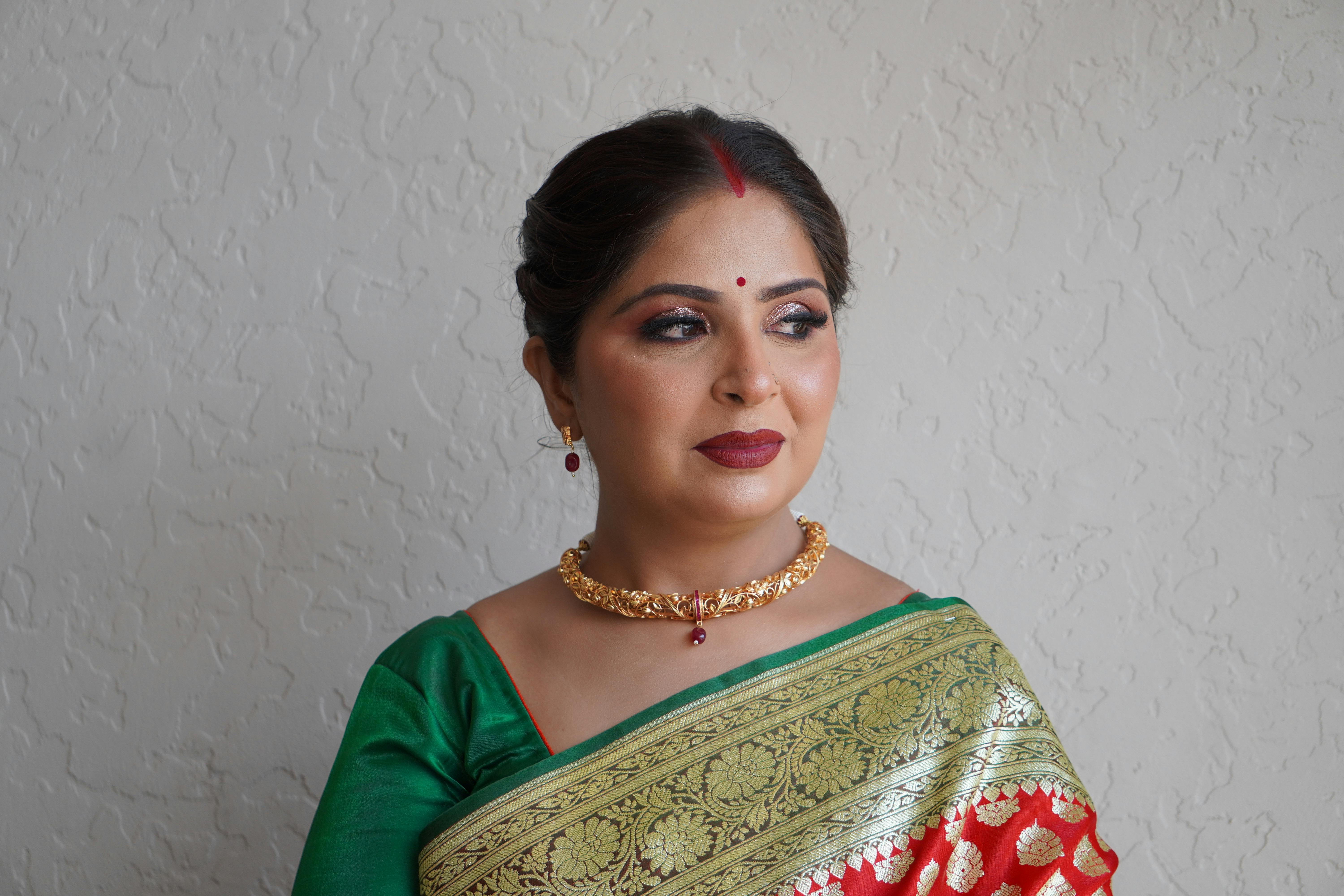 woman in traditional clothing and with necklace