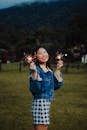 Photo of a Woman Holding Sparklers