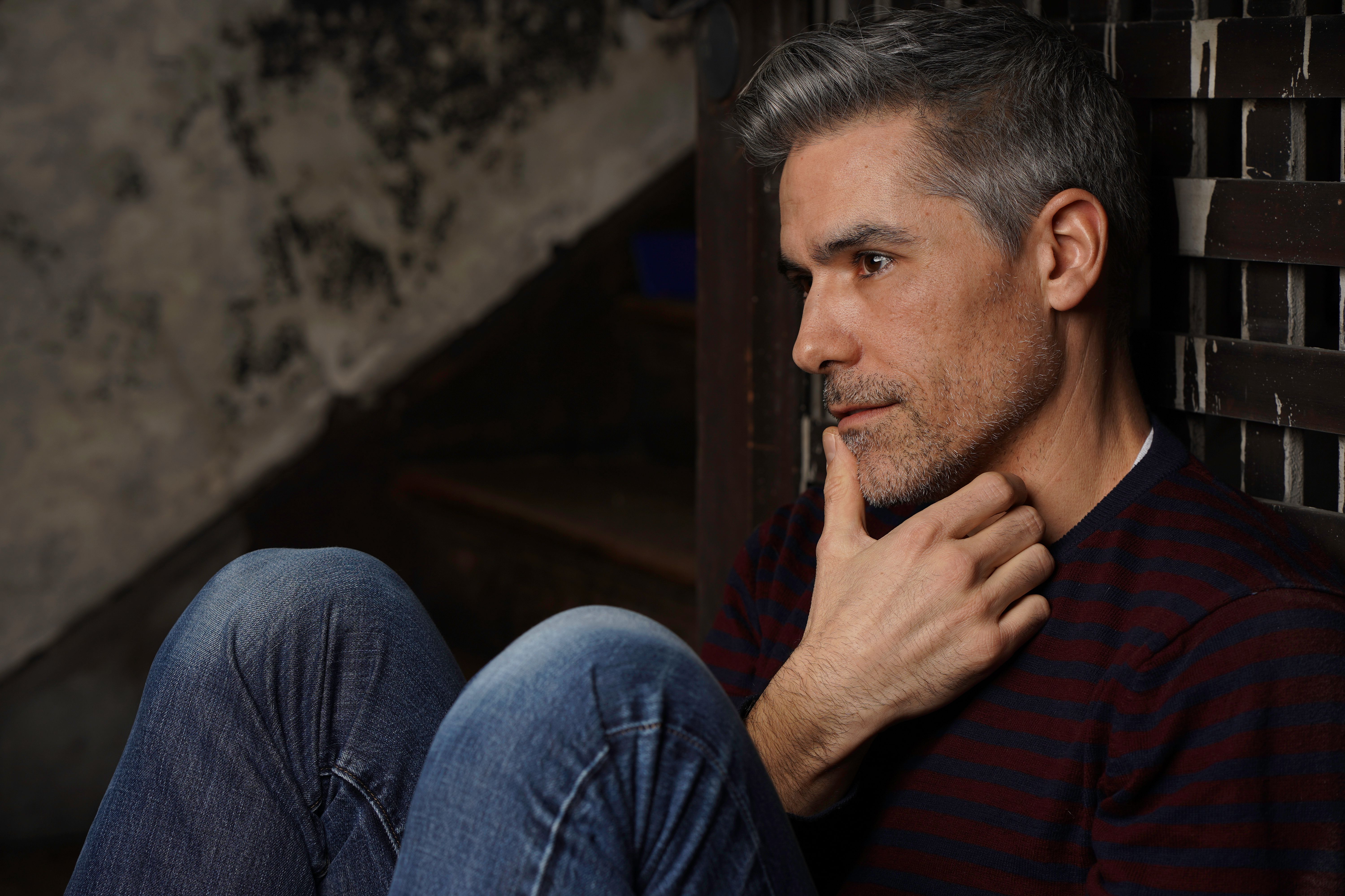 Man Wearing Red and Black Stripe Shirt