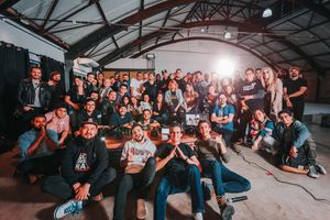 A group posing together at a warehouse gathering, photo by Matheus Bertelli on Pexels