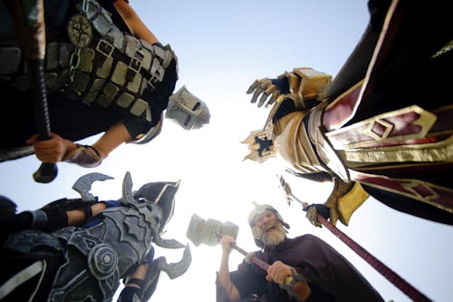 Low Angle View of Men Friends Against Sky