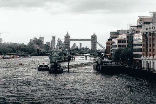 Free A captivating view of London's skyline featuring Tower Bridge and the bustling River Thames. Stock Photo
