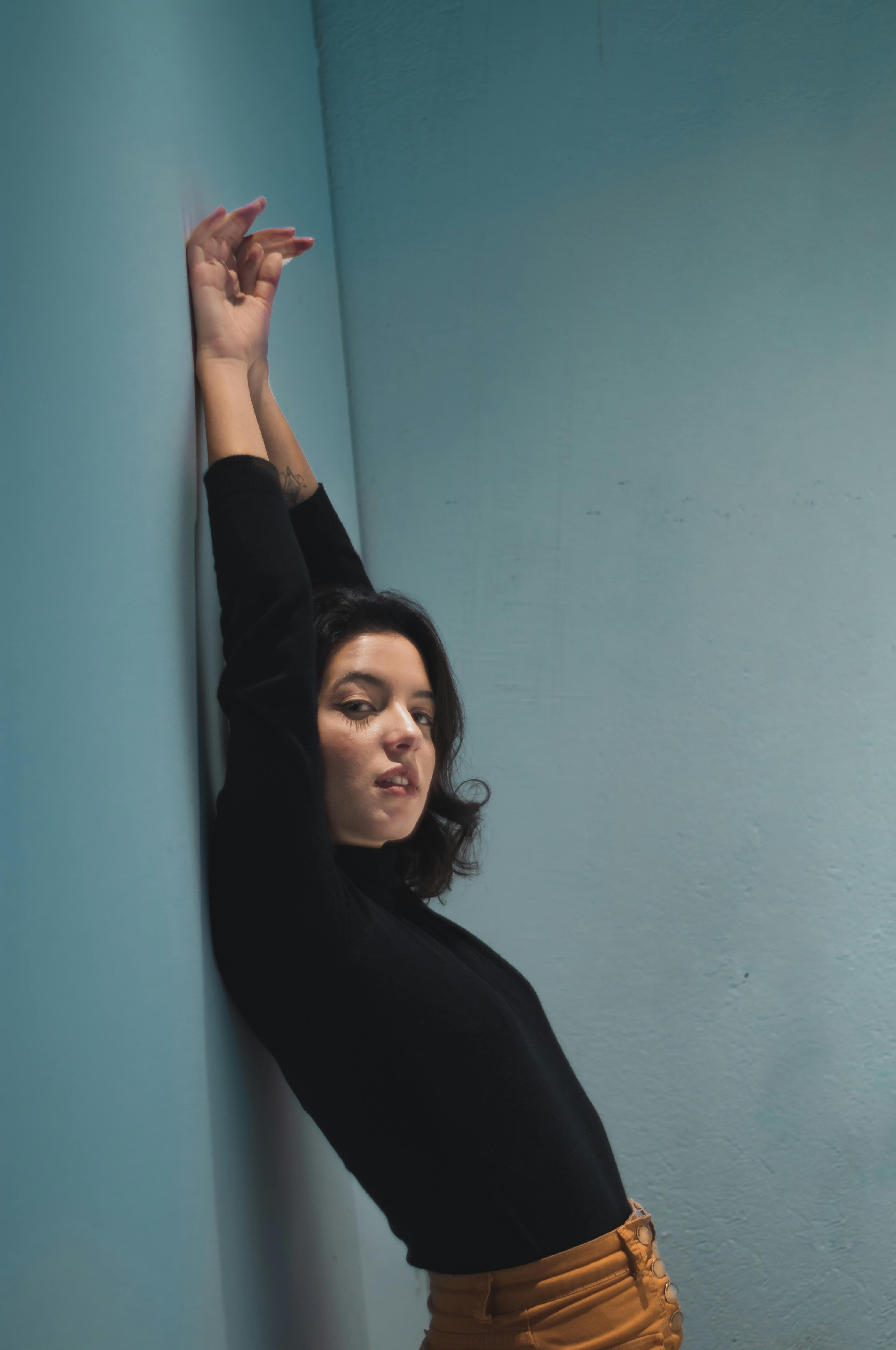 Woman Standing Near Wall · Free Stock Photo