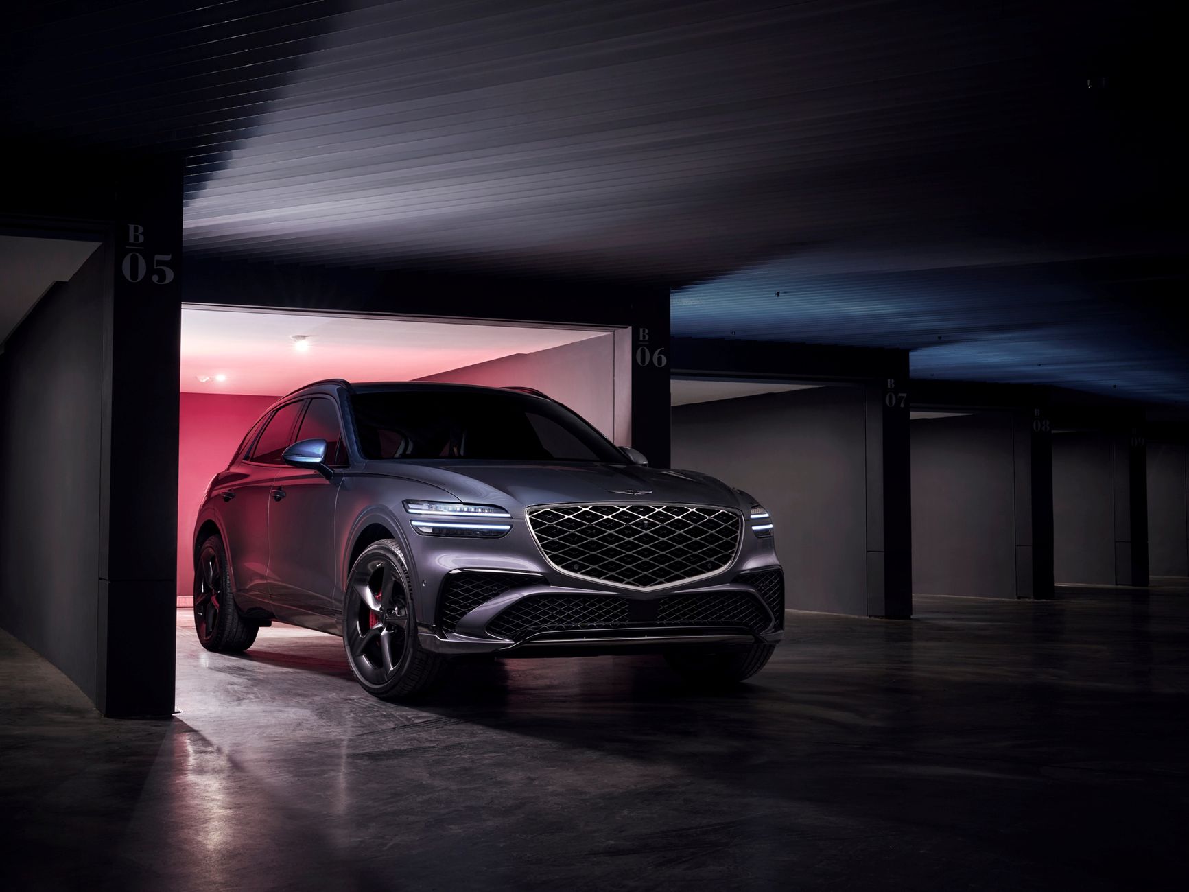 Modern Genesis GV70 SUV parked stylishly in a contemporary garage setting.
