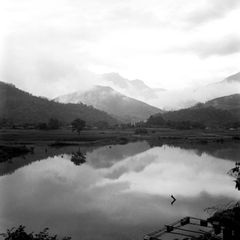 Mountains reflected in still water, photo by Q. Hung Pham on Pexels