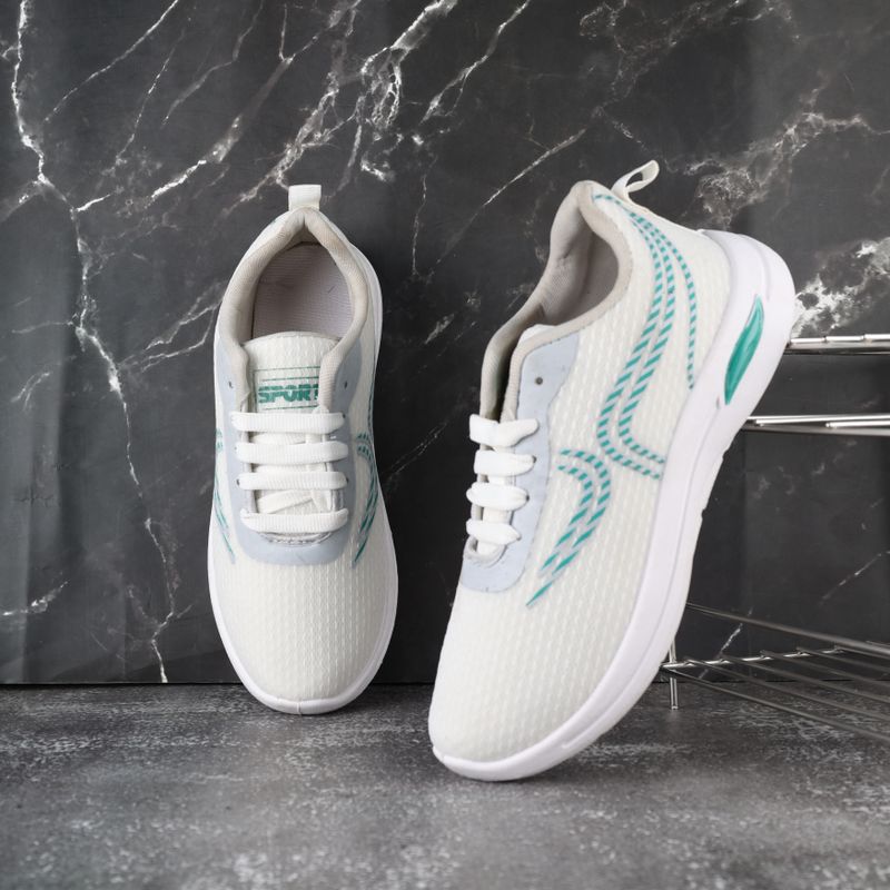White running shoes on a dark surface, photo by ALOK DAS on Pexels