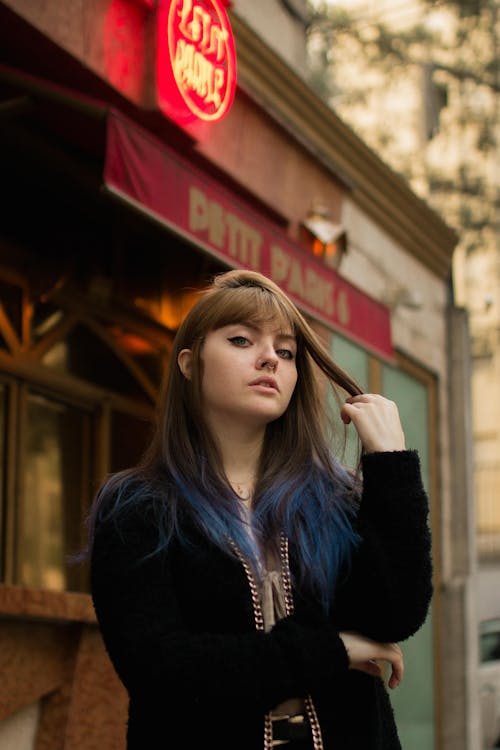 Photo of Woman Holding Her Hair