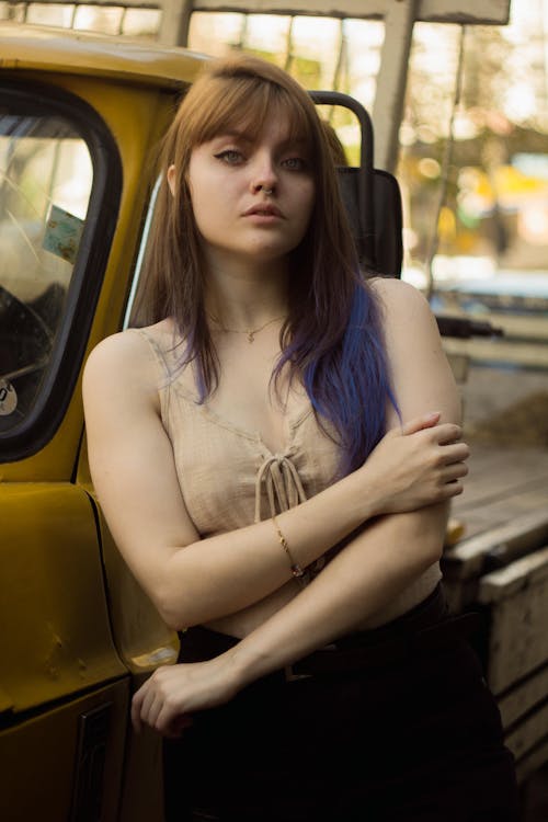 Free Photo of Woman Leaning on Vehicle Stock Photo