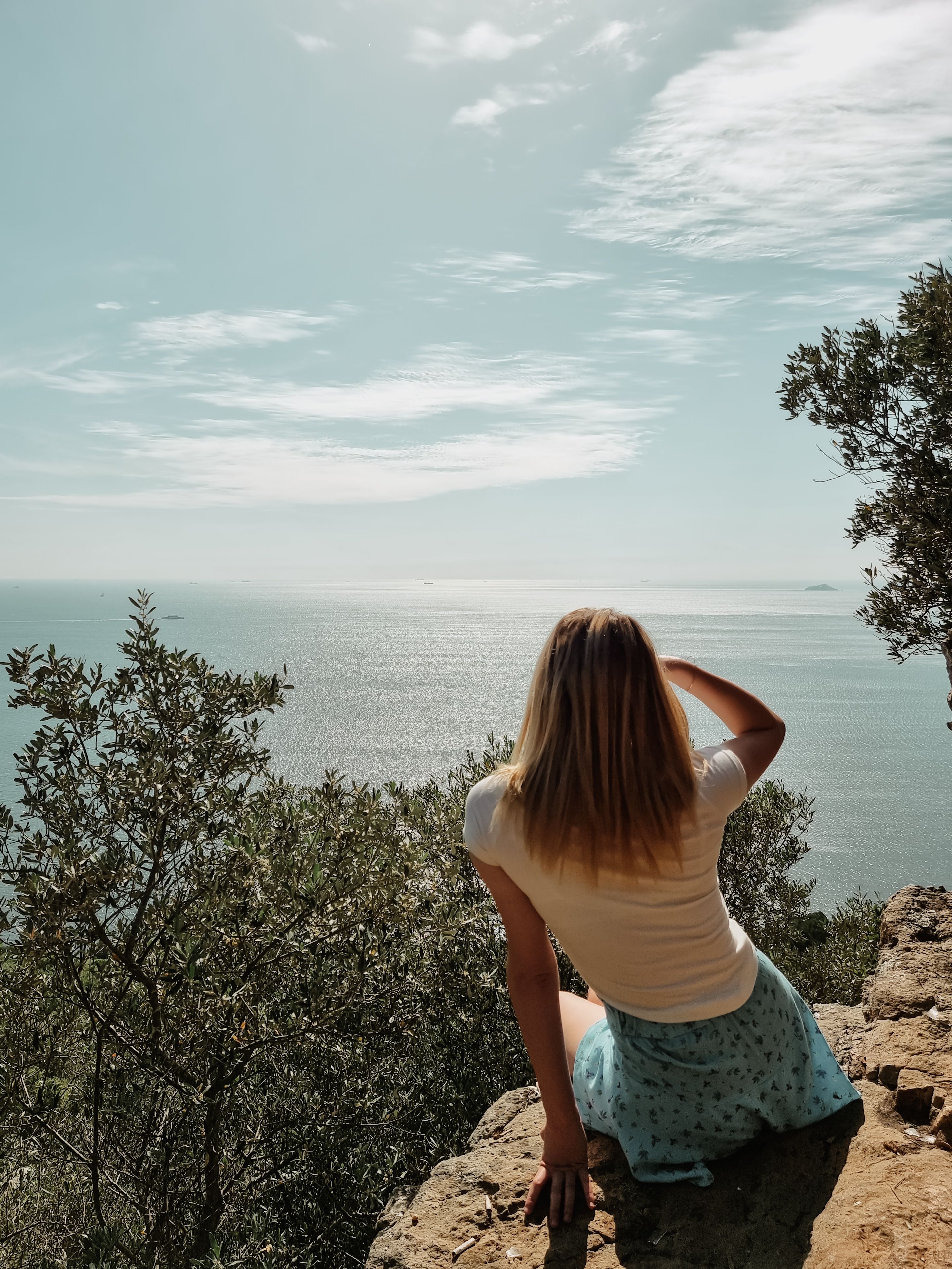 Back of a Woman Looking at the Sea from a Coastal Clifftop · Free Stock ...