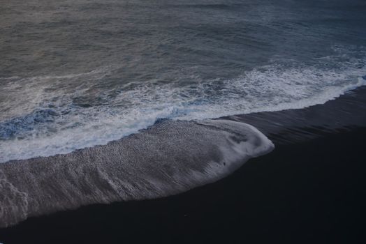 Peaceful waves wash over the iconic black sand beach in Vik, Iceland. A tranquil seascape.. pexels, peaceful, waves