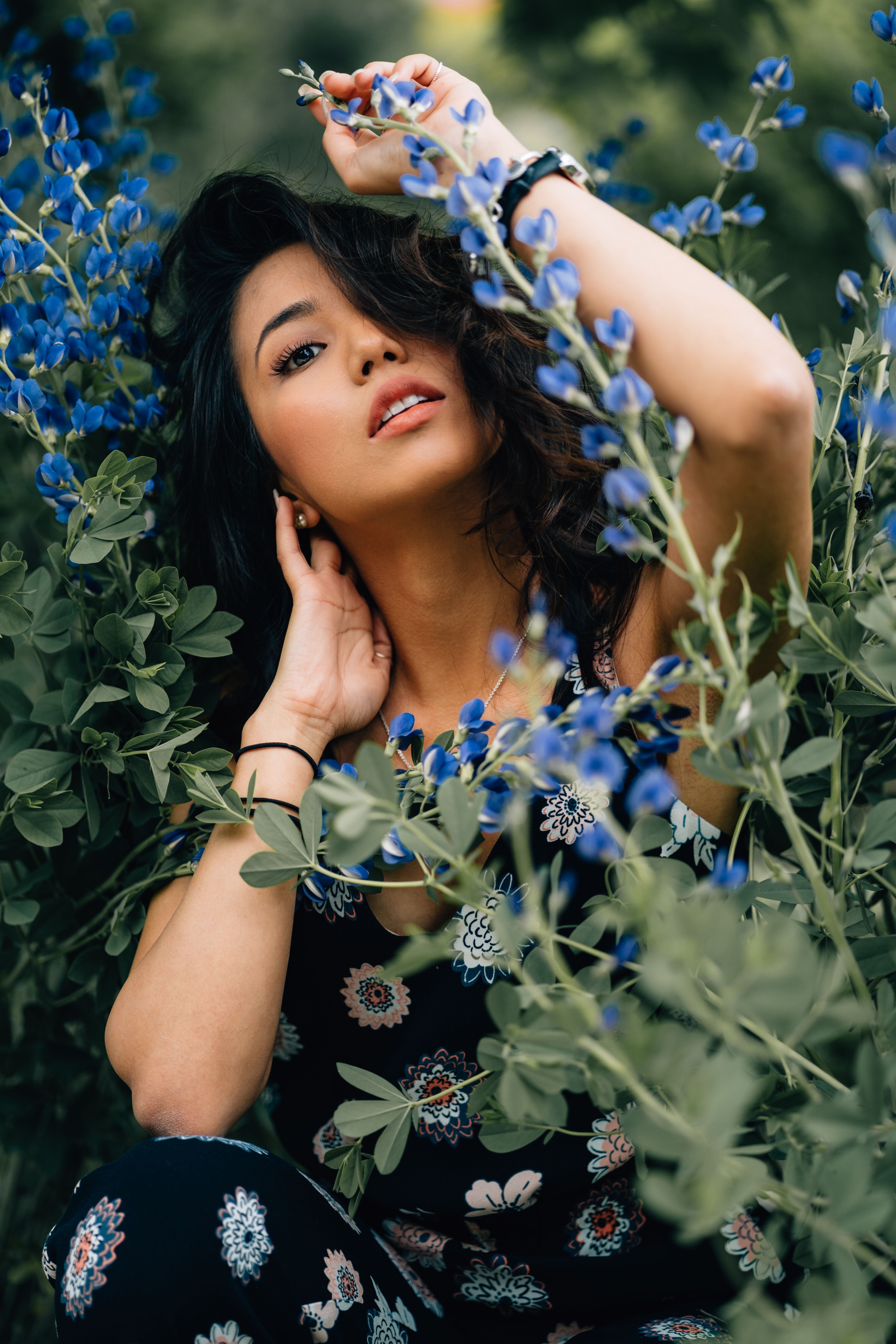 Photo of Woman in Floral outfit Posing by Blue Flowering Plant · Free ...