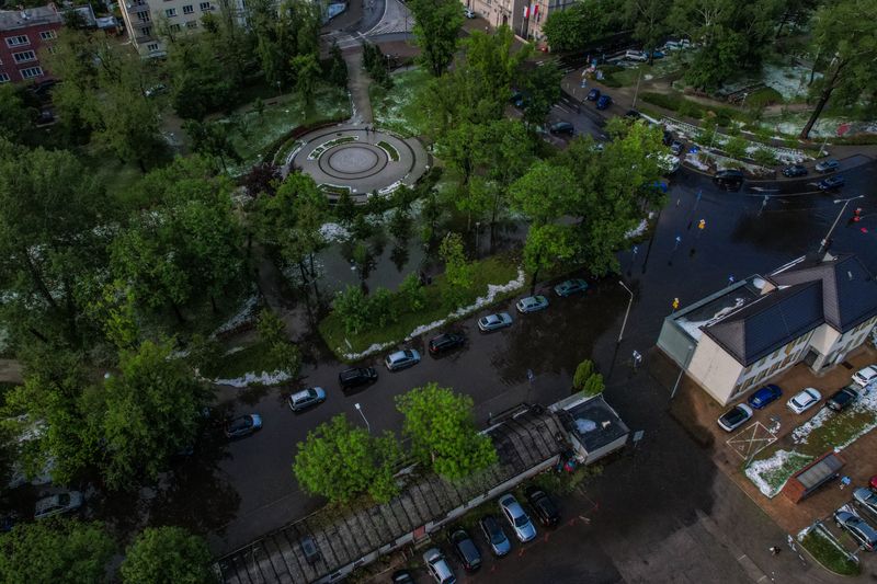 Aerial shot of a flooded city park and surrounding streets after a storm.