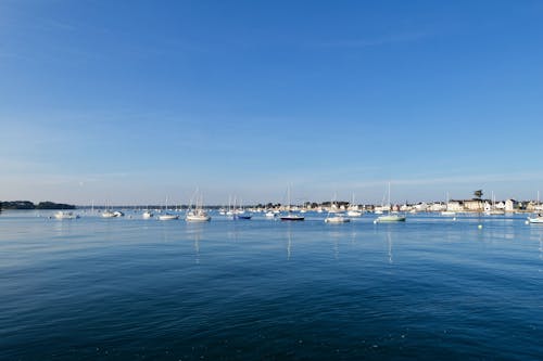 A view of boats in the water with blue sky