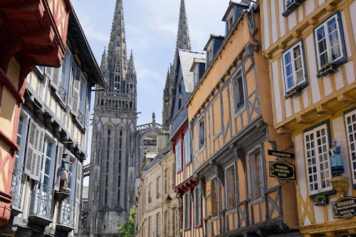 A street with buildings and a cathedral in the background