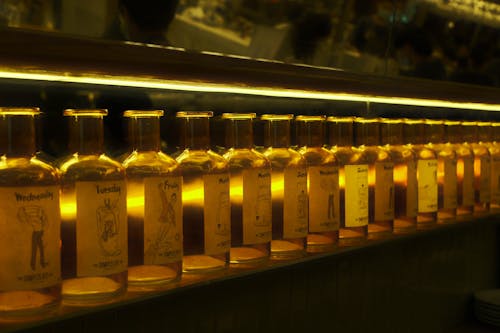 A row of bottles on a shelf