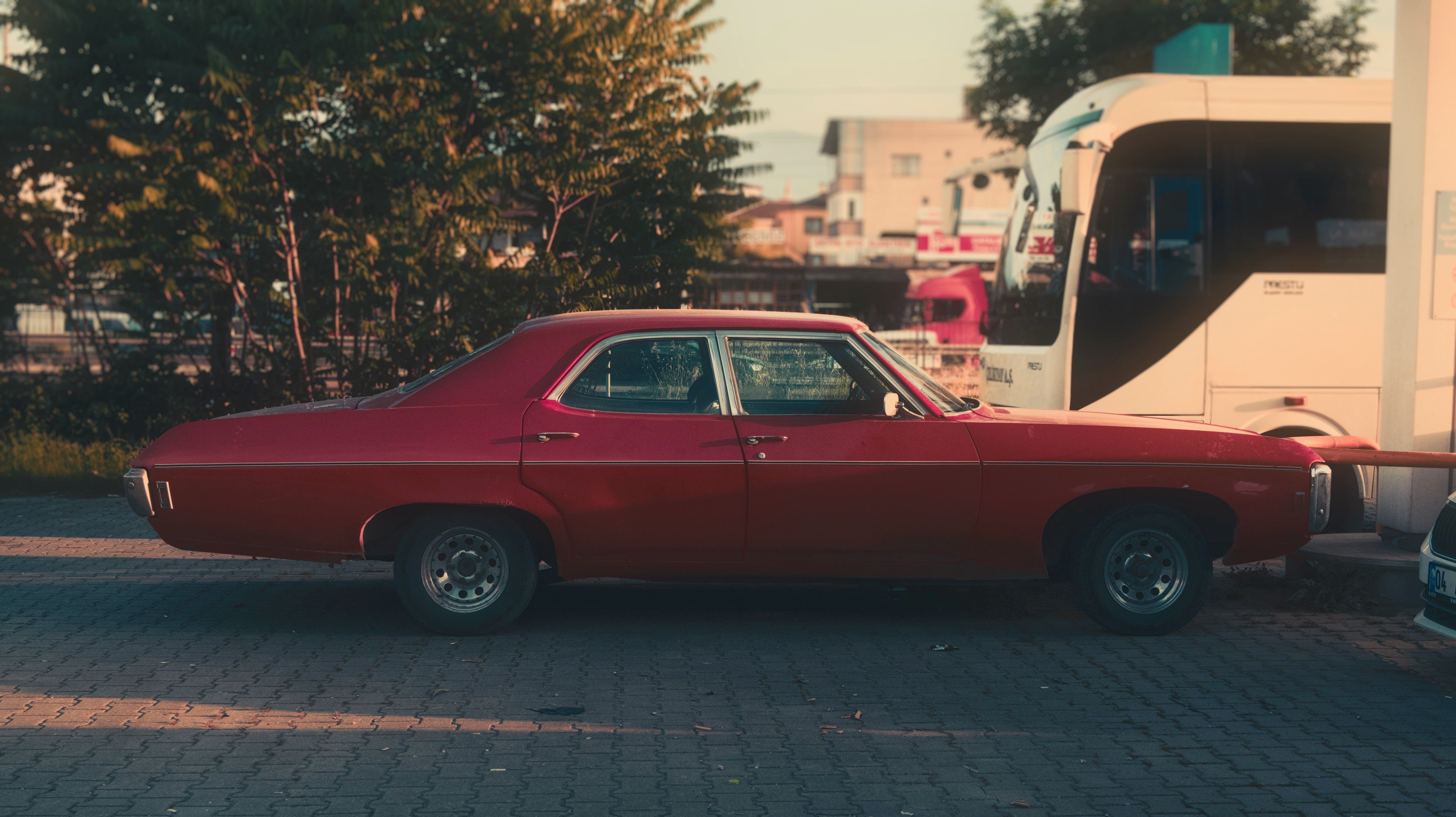 Burgundy Vintage Car on a Street · Free Stock Photo