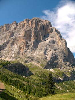Breathtaking view of Sassolungo mountain in Selva di Val Gardena, Italy, during summer.