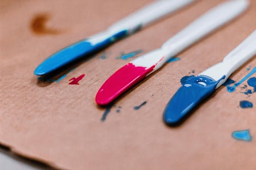 Close-Up Photo of Blue and Red Acrylic Paint