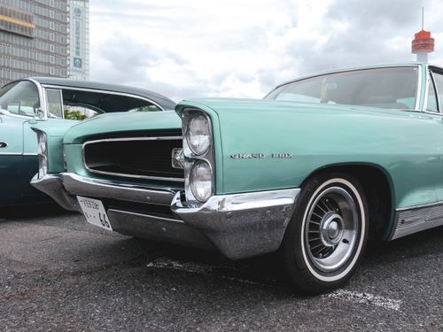 Free Classic Pontiac Grand Prix car in a parking lot, showcasing vintage American automotive design. Stock Photo