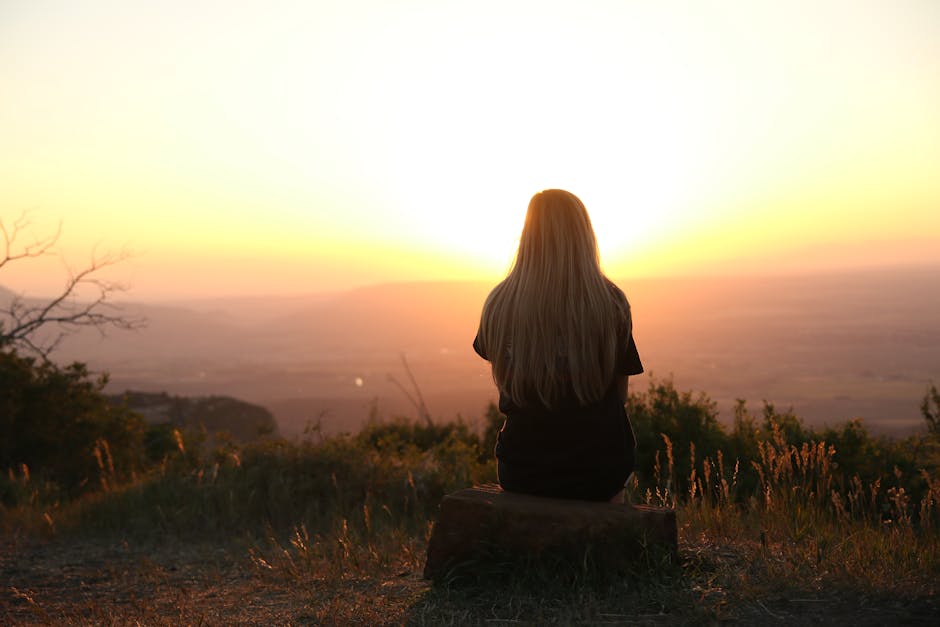 How to Cope With Loneliness. Woman Looking at Sunset