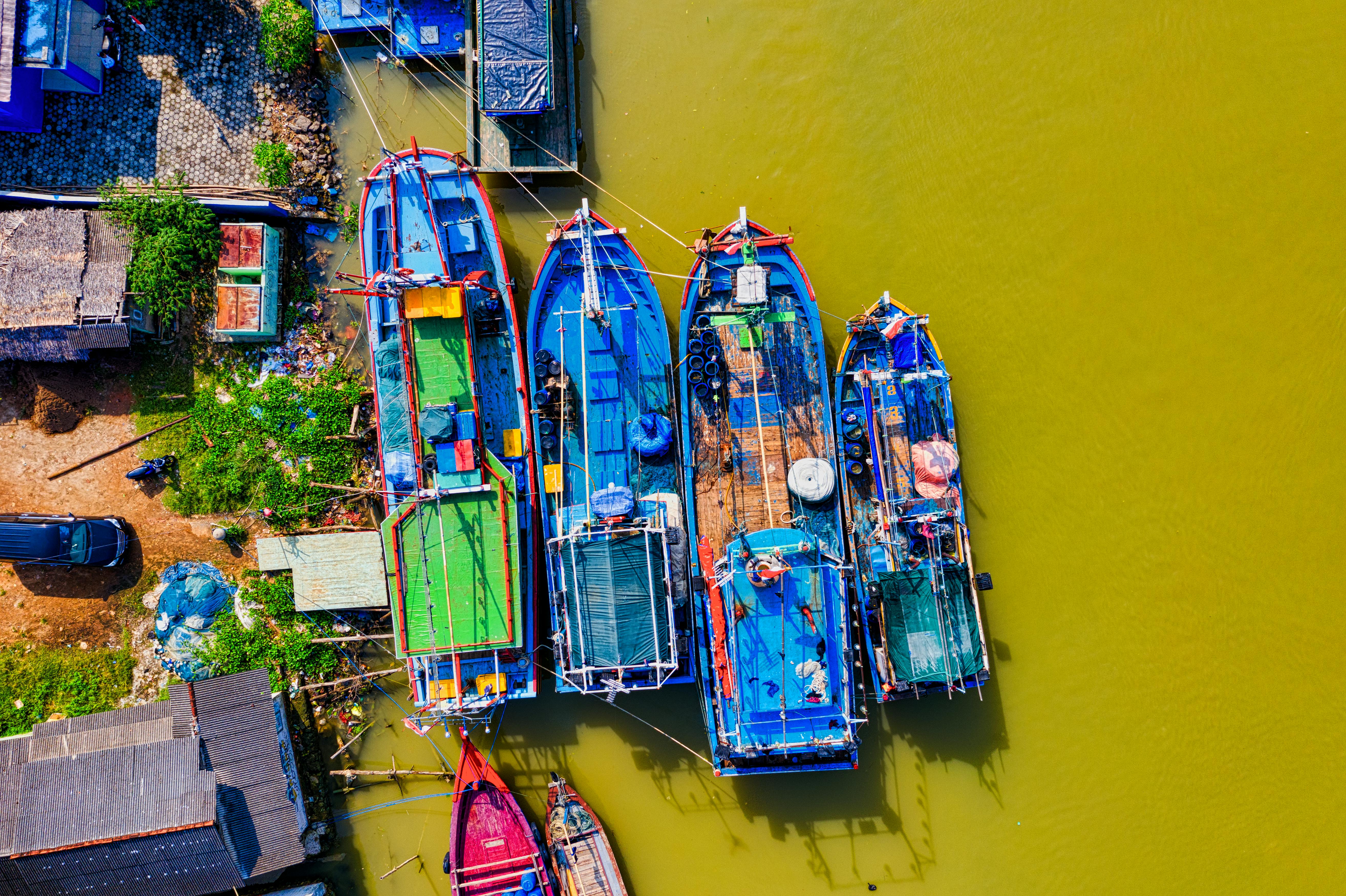 lined blue and green painted boats