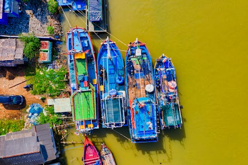 Lined Blue and Green Painted Boats